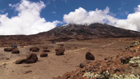 Time-lapse-shot-of-people-hiking-on-the-uhuru-trail,-towards-the-summit-of-mount-Kilimanjaro,-on-a-sunny-day,-in-Tanzania,-Africa