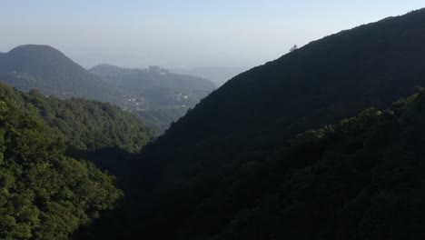 An-aerial-view-of-Taipei-from-the-mountains,-where-you-can-see-the-haze-and-pollution-around-the-city