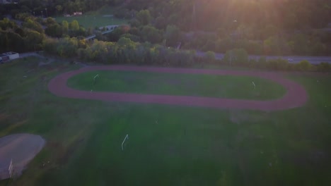 4k-Drone-Footage-of-Green-Soccer-Field-at-a-Park-in-Toronto,-Canada