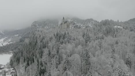 Aerial-View-Of-Neuschwanstein-getting-altitude-while-flying-towards-to-the-castle