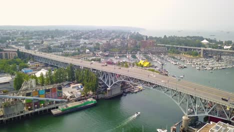Aerial-4K-Drone-Zooming-Out-of-Bridge-with-Traffic-Cars-and-Reavealing-Vancouver,-Canada