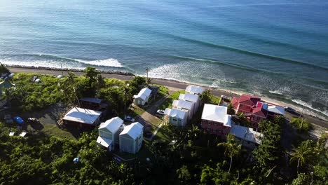 Aerial-decending-shot-to-a-local-home-on-a-beach-BVI-island-Tortola