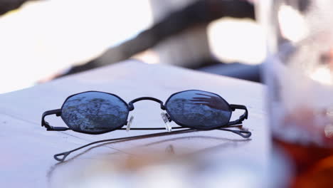 Sunglasses-on-table