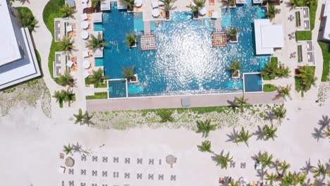 Beach-Resort---Aerial-View-Of-Swimming-Pool-Of-Hyatt-Zilara-Cap-Cana-And-Playa-Juanillo-On-A-Sunny-Summer-Day-In-Punta-Cana,-Dominican-Republic