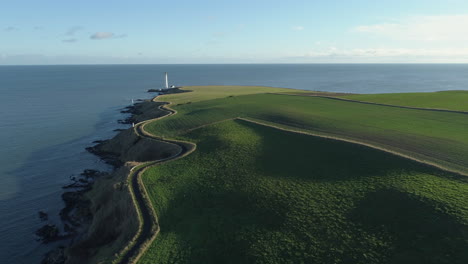 Aerial-footage-of-Scurdie-Ness-lighthouse-in-Montrose,-Scotland