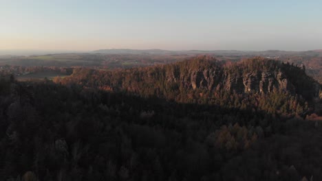 AERIAL:-View-over-the-beautiful-landscape-of-Saxon-Switzerland-during-sunset