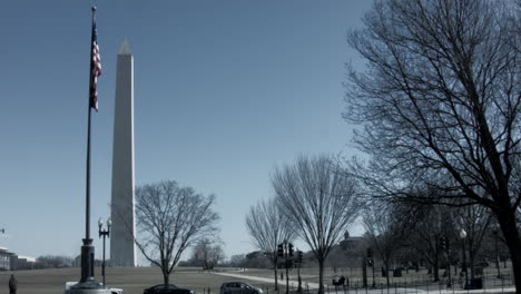 Wide-shot-of-the-Washington-Monument-with-American-Flag