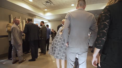People-entering-a-wedding-reception-in-slow-motion