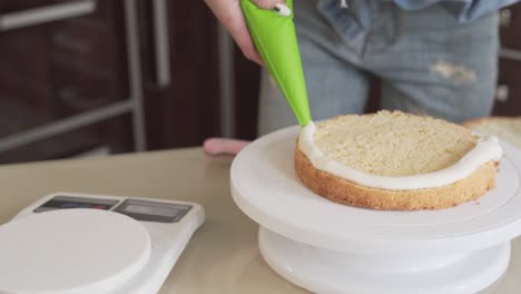 Close-up-video-of-a-woman-making-a-cake