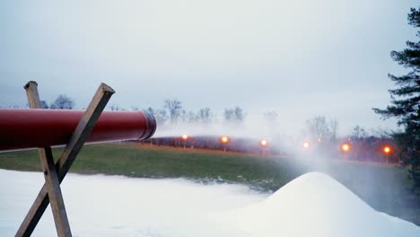 Snow-cannon-makes-artificial-snow-at-night