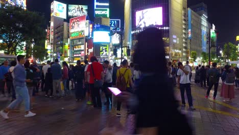 POV-walking,-Thousands-of-people-walk-across-the-famous-Shibuya-Crossing-in-Tokyo-Japan