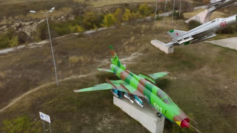 Aerial-panning-footage-of-military-airplanes-outdoor-museum-exhibition