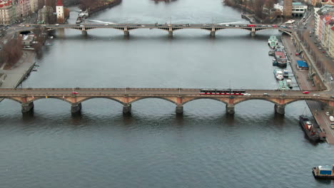drone-flight-over-vltava-river-in-prague-close-tho-bridge