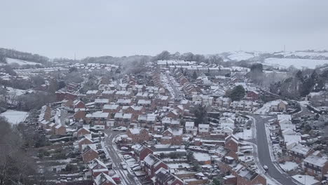 High-descending-drone-shot-of-snowy-Exeter-subburbs-CROP