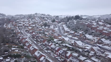 Low-dolly-forward-drone-shot-of-snowy-Exeter-subburbs-CROP