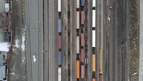 Aerial-top-view-of-Train-yard-with-birds-flying-over