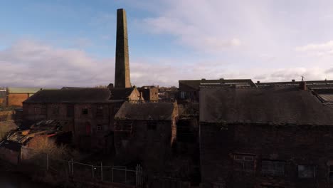 Aerial-footage-of-an-old-abandoned,-derelict-pottery-factory-and-bottle-kiln-located-in-Longport,-Stoke-on-Trent,-Staffordshire