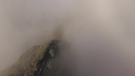 Oahu's-Haiku-Stairs-descend-into-cloud