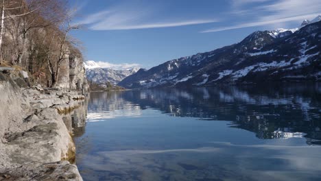 Beautiful-shot-of-a-mountain-lake-in-Switzerland-while-winter