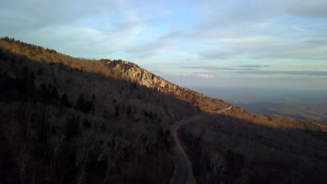 Aerial-at-sunset-of-Rough-Ridge-in-the-background-as-it-lies-beside-the-Blue-Ridge-Parkway-in-the-mountains-of-North-Carolina