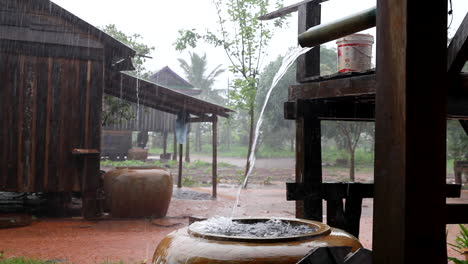 Rain-water-falling-into-a-clay-pot-in-a-village-in-Cambodia