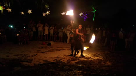 Male-and-Female-variety-artist-performing-fire-show-outdoors-in-the-dark