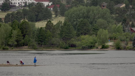 Old-couple-fishes-on-a-lake-in-Colorado