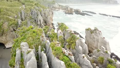 Drone-view-of-the-pancake-rocks-at-Dolomite-point,-Punakaiki,-New-Zealand