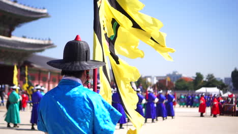 Slow-motion-of-royal-guard-holding-flag-at-Gyeongbokgung-Palace