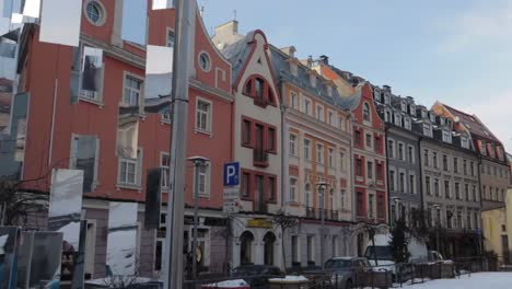 Beautiful-dreamy-art-structure-made-of-mirrors-in-Riga-old-town-street-on-a-bright-sunny-day-and-typical-houses