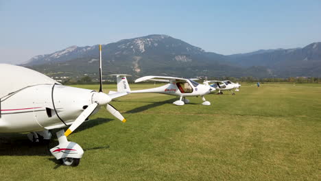 Light-sport-airplanes-on-grass,-bush-airport
