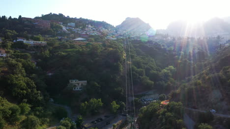 Bird's-eye-view-on-a-long-cable-way-leading-to-the-top-of-the-mountain