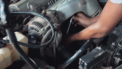 Super-Close-Shot-of-a-Mechanic-Fixing-a-Car
