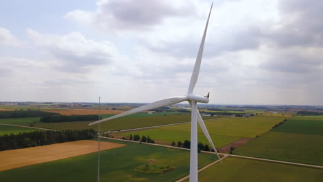 Aerial-flying-around-the-spinning-blades-of-a-wind-turbine
