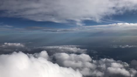 Clouds-drift-by-during-a-flight-in-the-upper-atmosphere-