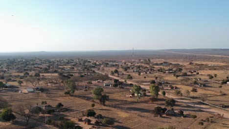 A-Push-In-Drone-Shot-of-an-African-Countryside-Area-under-sunny-conditions
