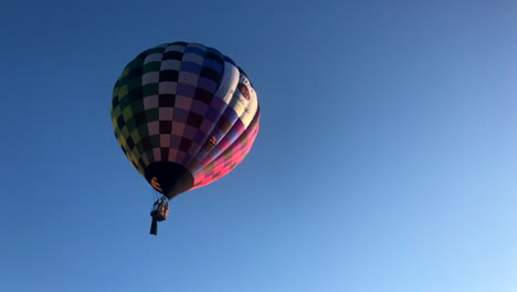 Checkered-hot-air-balloon-floats-into-the-sky