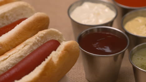 Pan-across-a-platter-of-hot-dogs-and-condiments