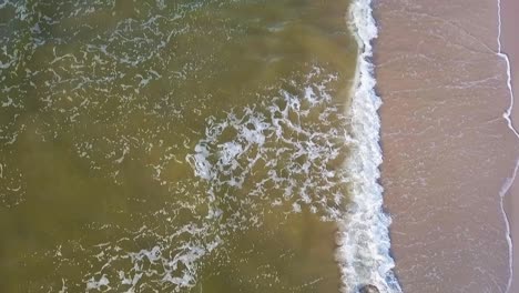 Aerial-View-Of-Sea-Waves-On-Sandy-Beach-Of-Baltic-Sea