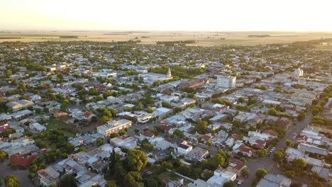 Aerial-Drone-shot-from-above-of-a-little-town-during-sunset,-in-Coronel-Dorrego,-Argentina