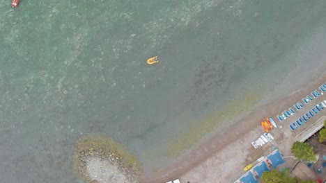 Birds-eye-view-aerial-drone-footage-of-adriatic-sea-beach-with-boats