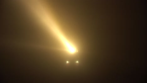 Famous-Lighthouse-at-the-island-of-Texel,-Netherlands,-in-dense-fog-with-large-beams-penetrating-through-the-mist,-in-a-long-shot