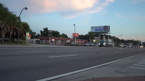 Cars-and-trucks-on-a-road-during-rush-hour-in-Orlando,-Florida