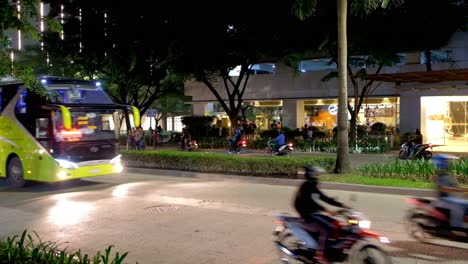 Outdoor-evening-scene-showing-vehicular-and-pedestrian-traffic-around-a-commercial-district-in-progressive-Cebu-City,-Philippines