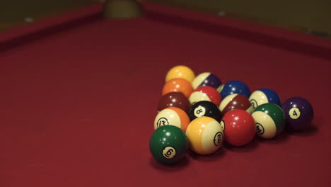 Slow-motion-medium-wide-shot-of-billiard-balls-being-struck