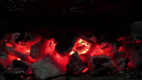 Fire-On-Coal-In-Furnace-Made-With-Bricks-While-Grilling-|-Close-Shot