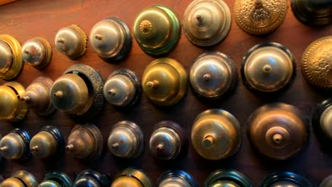 Old-hotel-desk-bells-decorating-the-front-lobby-of-a-modern-upscale-hotel