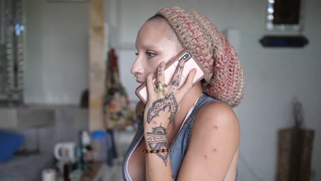 A-young,-cool,-tattooed,-alternative-looking-girl-with-a-beanie-is-having-an-intense-argument-over-the-phone-with-someone
