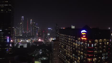 Bird-eye-view-of-Citic-plaza-linhexi-area-and-CBD-and-Canton-tower-at-night-in-the-background,-Guangzhou,-China