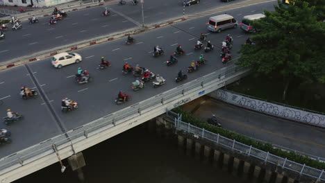 Evening-panning-aerial-view-of-Dien-Bien-Phu-Bridge,-Binh-Thanh-district,-Ho-Chi-Minh-City,-Vietnam-which-crosses-the-Hoang-Sa-canal
